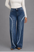 Jean femme bleu coupe large avec empiècements effilochés – vue de face